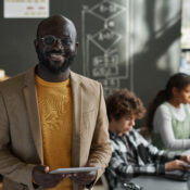 IT teacher standing in classroom